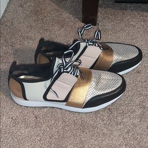 Black, gold and tan sneakers